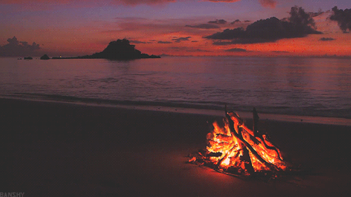 Beach Bonfire under a Fiery Sky